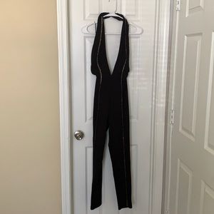 Black jumpsuit with gold chains